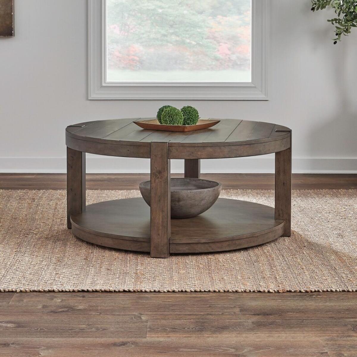 93897bde794cdfbfcc8c12344dfd2110 Broadmore Round Cocktail Table - Image 1