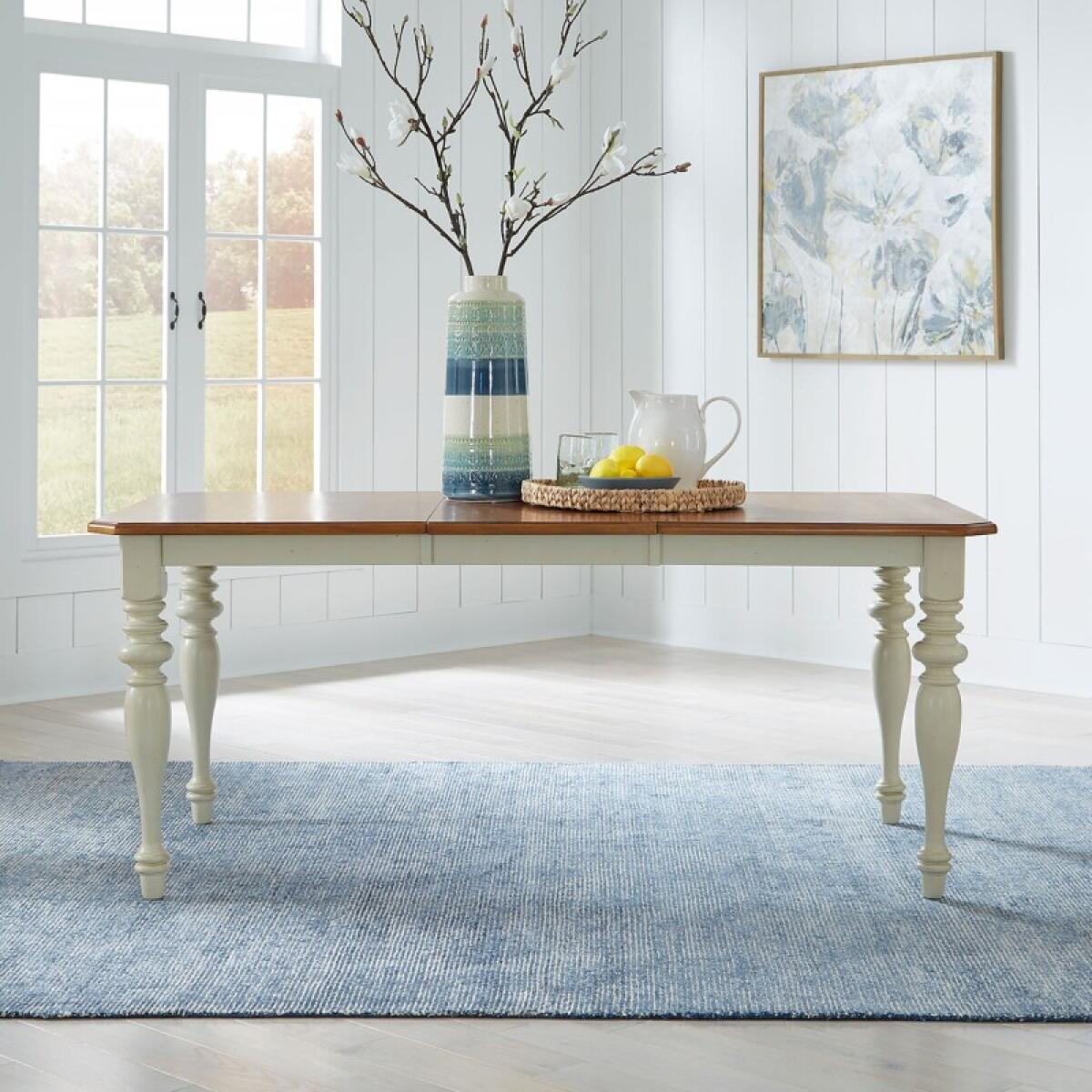 f5b0793a425cbae9d637bcf2508961a3 Ocean Isle Rectangular Leg Table - Image 1