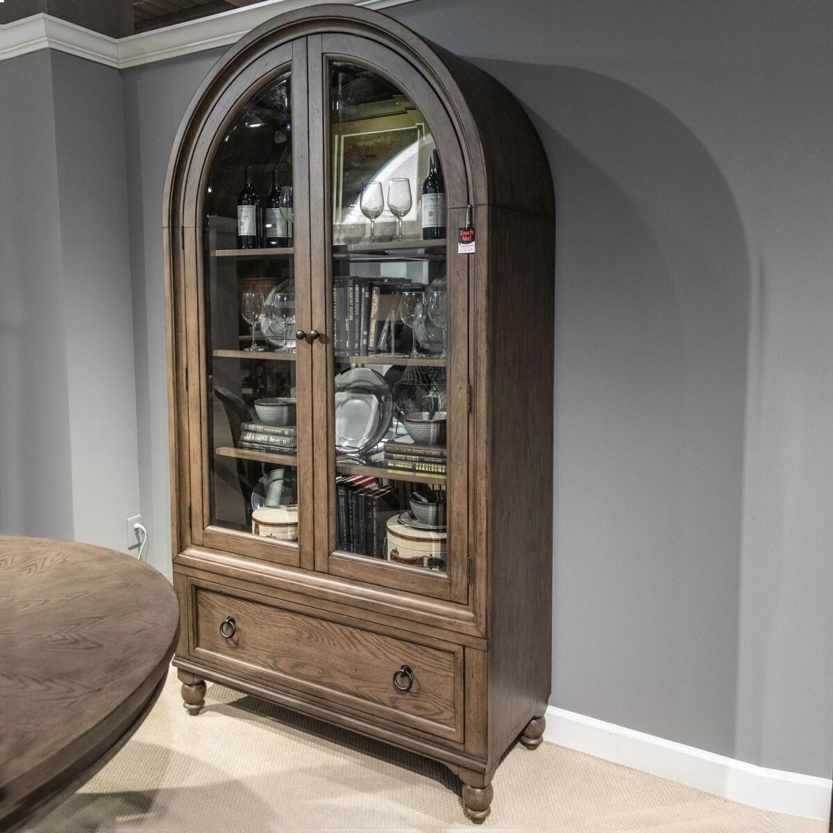 592f11ba61e0c1305466bc21069f19a2 Americana Farmhouse Arched Display Cabinet - Image 1
